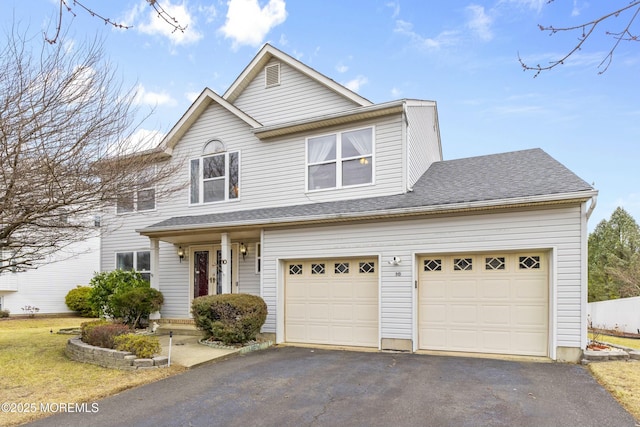 view of front facade featuring a garage, roof with shingles, and driveway