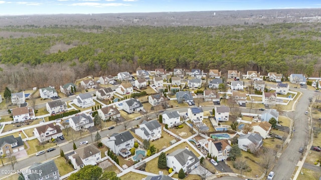 bird's eye view with a residential view and a view of trees