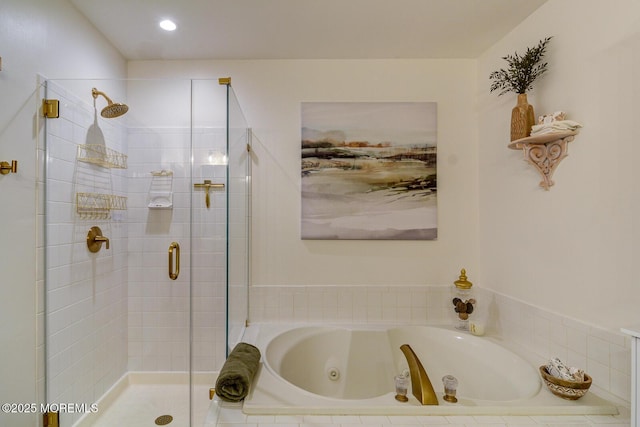 full bathroom with a shower stall and a jetted tub