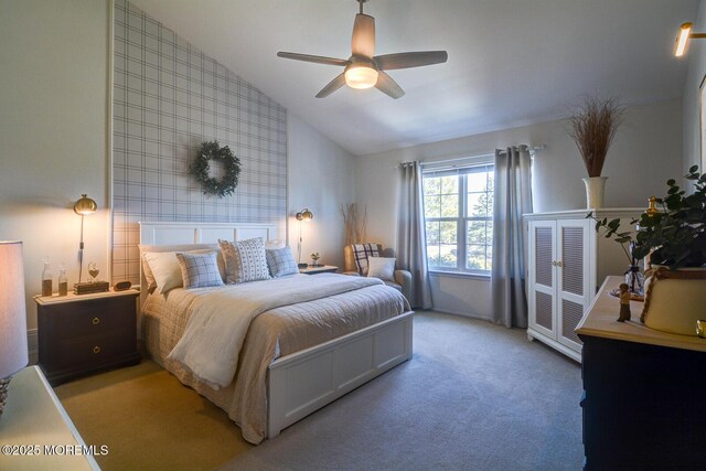 bedroom featuring ceiling fan, lofted ceiling, and light carpet