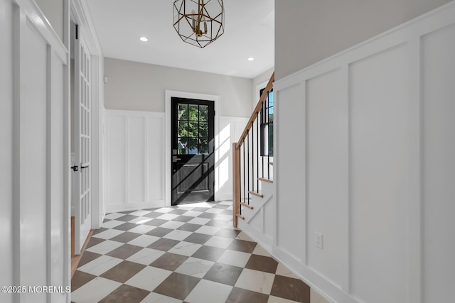 121 Black Point Rd, Rumson, NJ 07760 - foyer entrance featuring a decorative wall, stairway, recessed lighting, a wainscoted wall, and tile patterned floors