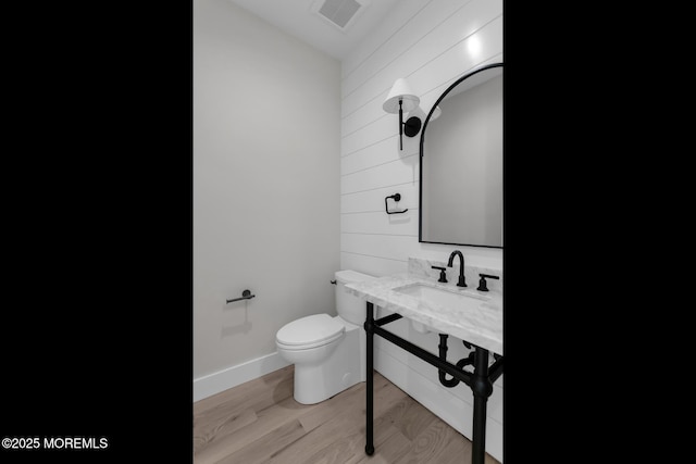 121 Black Point Rd, Rumson, NJ 07760 - half bathroom featuring wood walls and wood finished floors