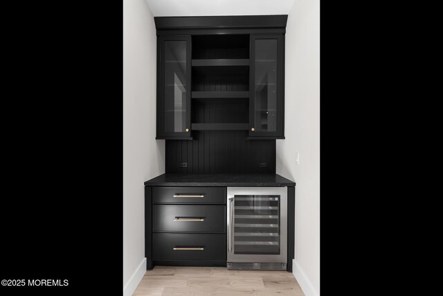 121 Black Point Rd, Rumson, NJ 07760 - indoor dry bar featuring beverage cooler and light wood finished floors