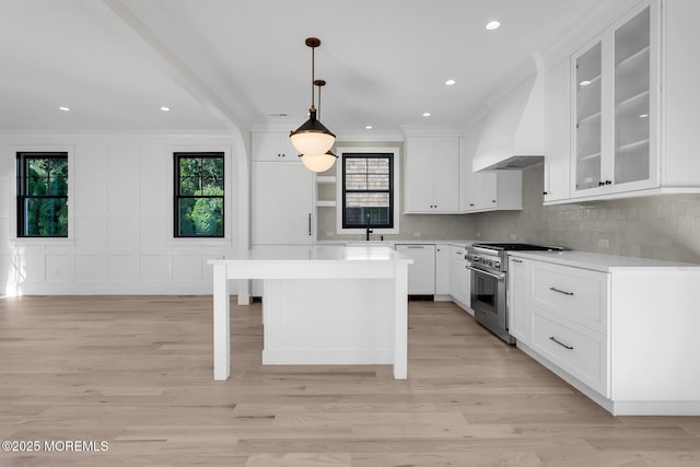 121 Black Point Rd, Rumson, NJ 07760 - kitchen with stainless steel range, crown molding, dishwasher, plenty of natural light, and light countertops