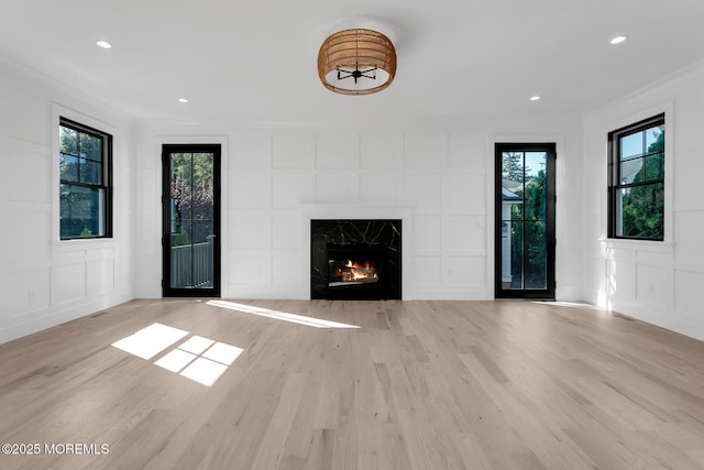 121 Black Point Rd, Rumson, NJ 07760 - unfurnished living room with a decorative wall, wood finished floors, a premium fireplace, crown molding, and recessed lighting