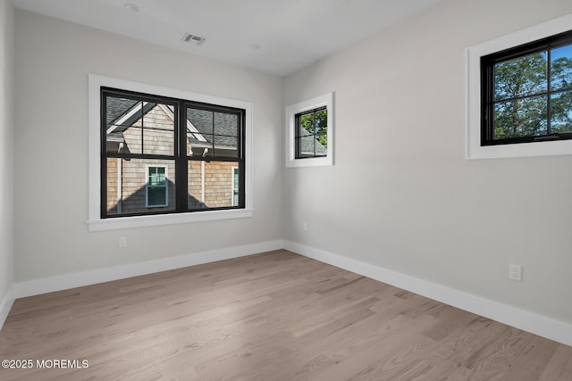 121 Black Point Rd, Rumson, NJ 07760 - empty room with healthy amount of natural light and light wood-style flooring