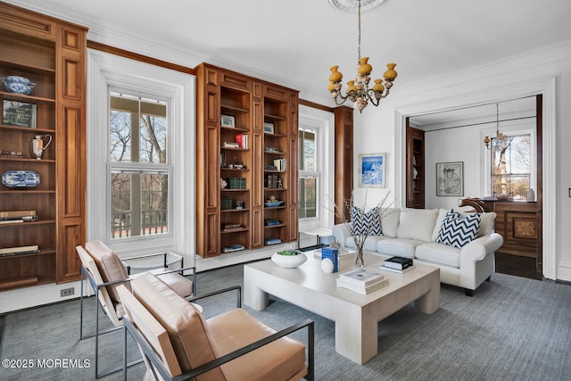 living area featuring an inviting chandelier, built in features, and crown molding