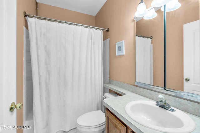 full bathroom featuring a chandelier, vanity, and toilet