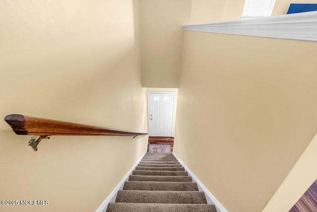 stairway with carpet flooring and baseboards