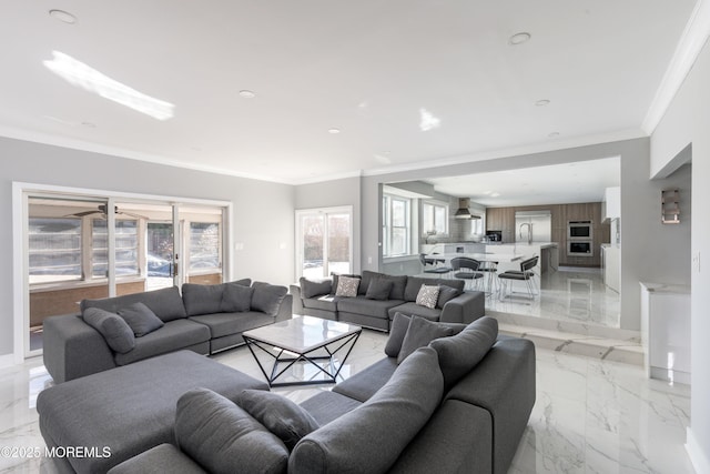 living room with ornamental molding, recessed lighting, and marble finish floor