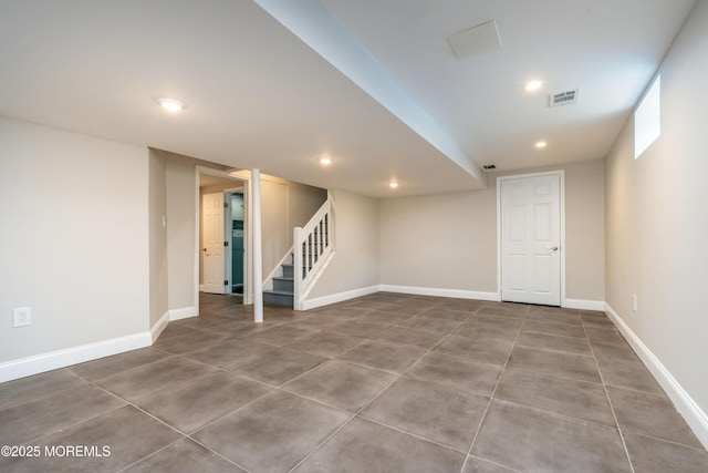 finished basement with recessed lighting, visible vents, baseboards, and stairs