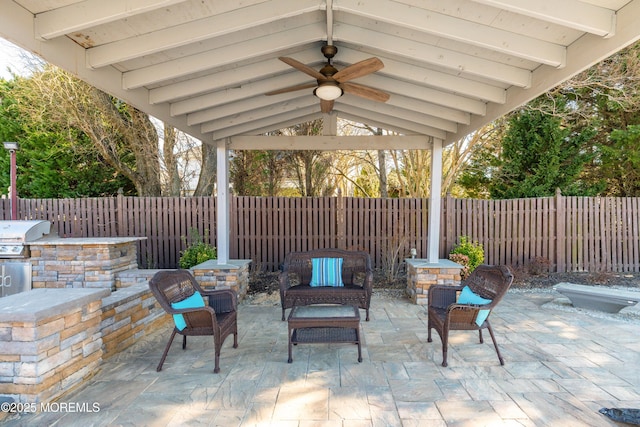 view of patio featuring a fenced backyard, a grill, ceiling fan, and a gazebo