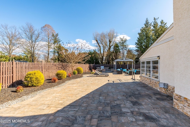 view of patio with a fenced backyard and an outdoor living space