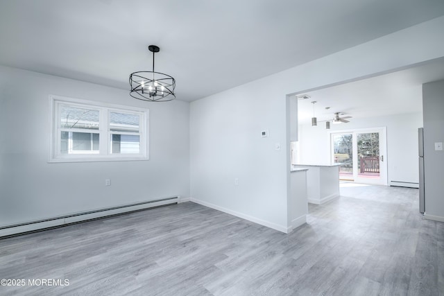 empty room featuring baseboard heating, a baseboard heating unit, light wood-type flooring, baseboards, and ceiling fan with notable chandelier