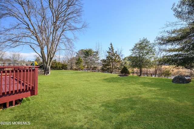 view of yard with a deck