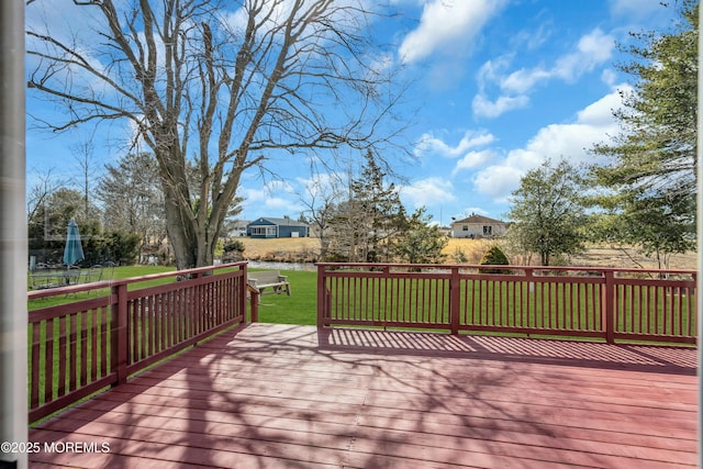 wooden terrace with a yard