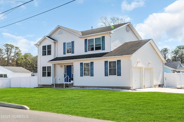 traditional home featuring a garage, driveway, fence, and a front lawn