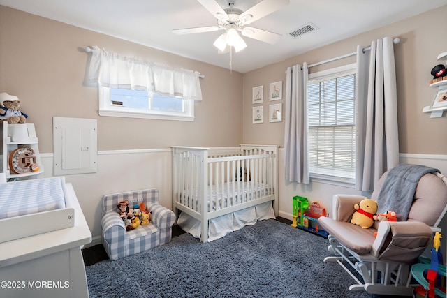 bedroom featuring ceiling fan and visible vents