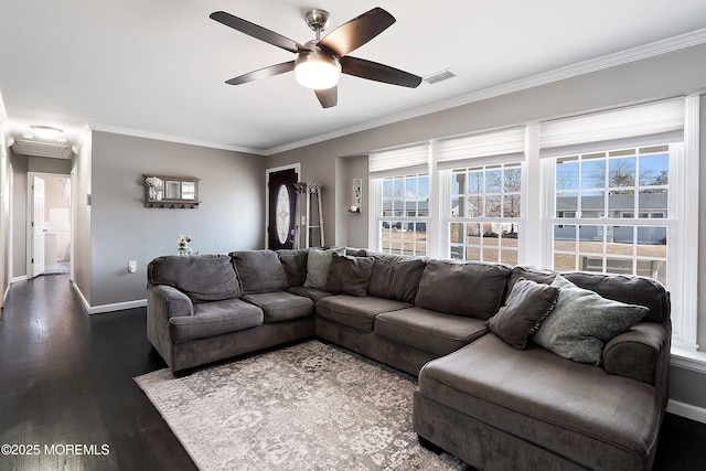 living room featuring dark wood-style floors, baseboards, visible vents, and crown molding