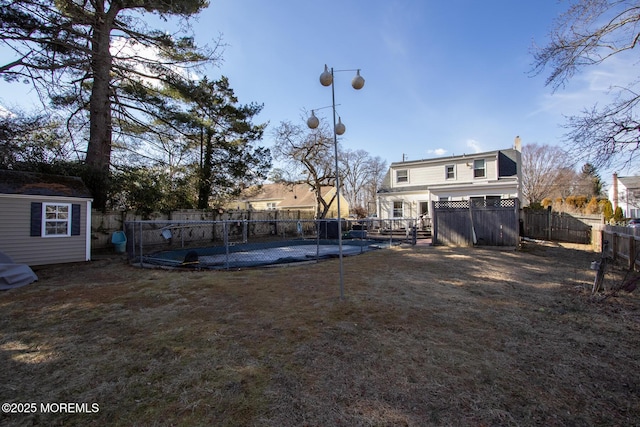 rear view of property with a fenced backyard