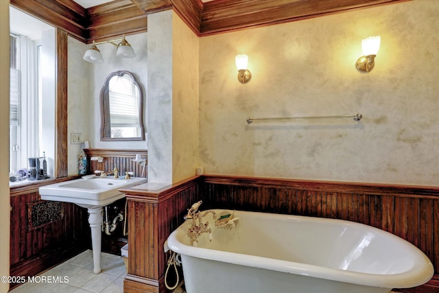 bathroom featuring a soaking tub and tile patterned floors