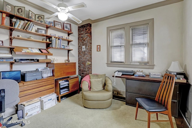 living area with ornamental molding, carpet, and a ceiling fan