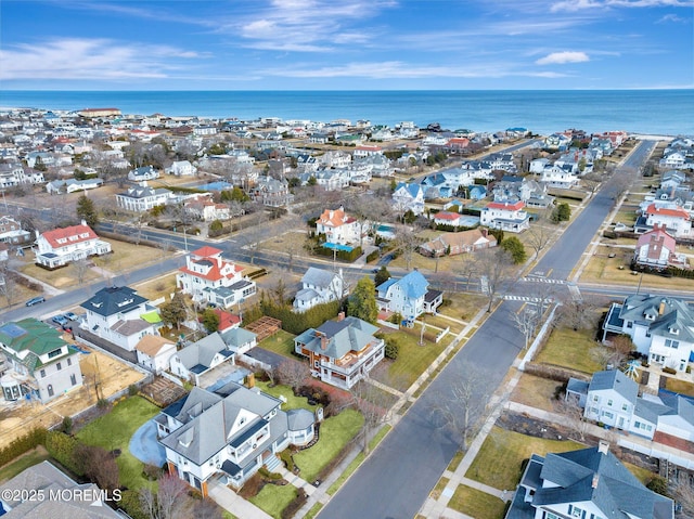 birds eye view of property featuring a water view and a residential view