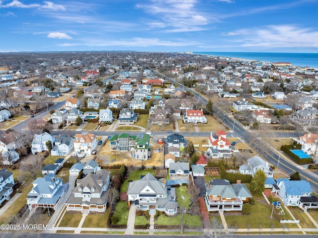 aerial view with a water view and a residential view