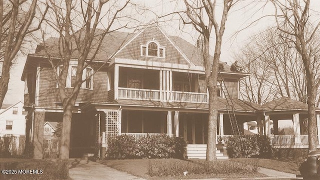 view of front of house featuring a porch and a balcony