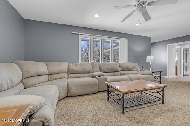 living area featuring ceiling fan, recessed lighting, light colored carpet, and baseboards