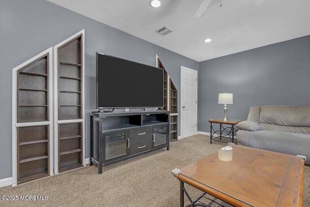 carpeted living room featuring a ceiling fan, recessed lighting, visible vents, and baseboards