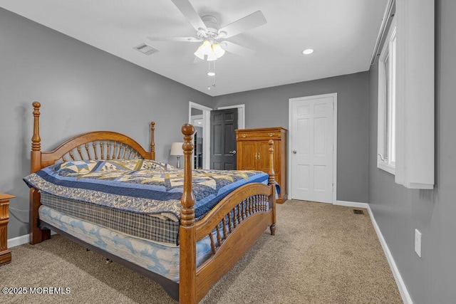 bedroom featuring light carpet, baseboards, visible vents, and a ceiling fan