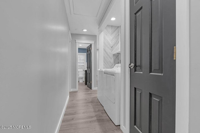 hall featuring recessed lighting, baseboards, wood finished floors, and independent washer and dryer