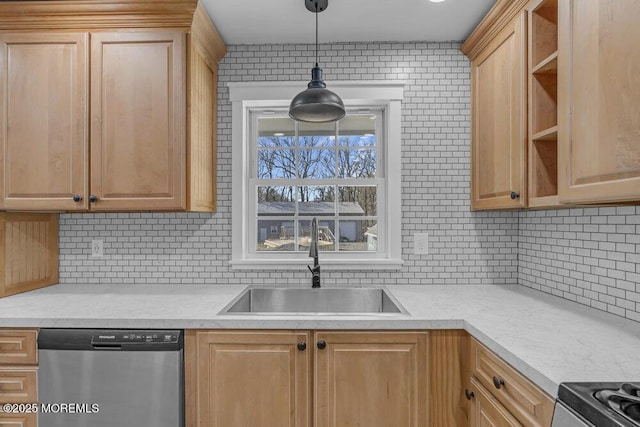 kitchen featuring decorative backsplash, light countertops, a sink, and stainless steel dishwasher