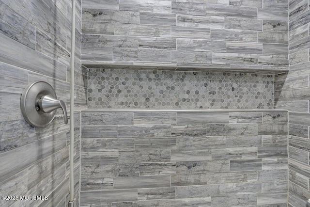 details featuring a tile shower