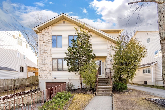 traditional home featuring fence