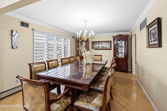 dining area with light wood-type flooring, visible vents, and ornamental molding