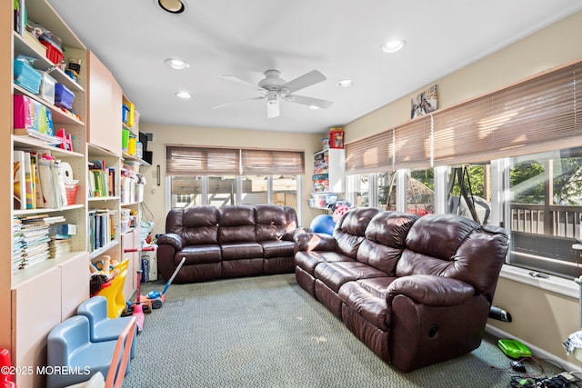 carpeted living area featuring recessed lighting and a ceiling fan