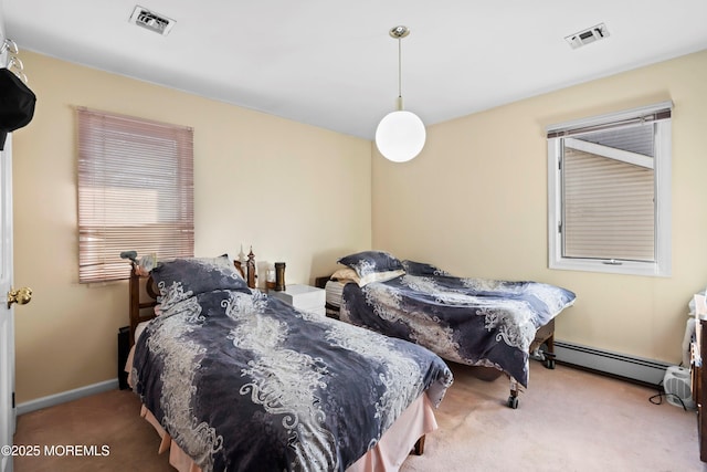 bedroom featuring baseboards, carpet, visible vents, and a baseboard radiator