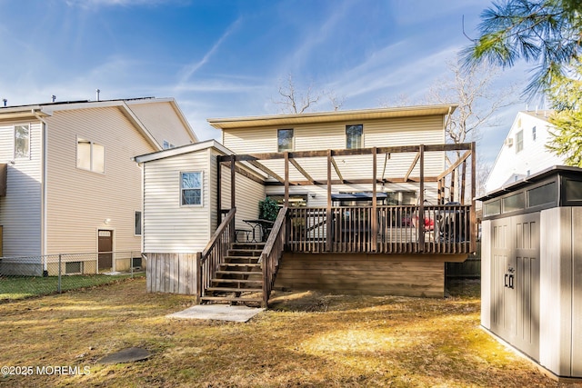 back of house with stairway, a deck, and fence