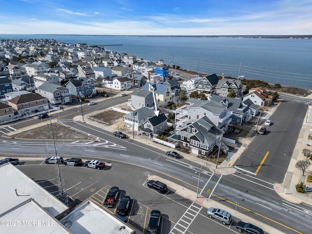 aerial view featuring a water view and a residential view