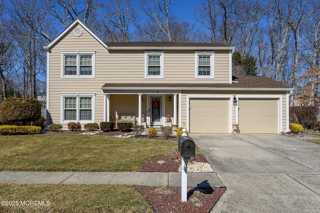 traditional-style home with covered porch, a front lawn, and concrete driveway