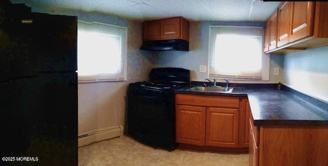 kitchen featuring a baseboard radiator, a sink, ventilation hood, black appliances, and dark countertops