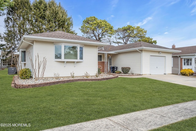 single story home featuring an attached garage, concrete driveway, a front lawn, and a shingled roof