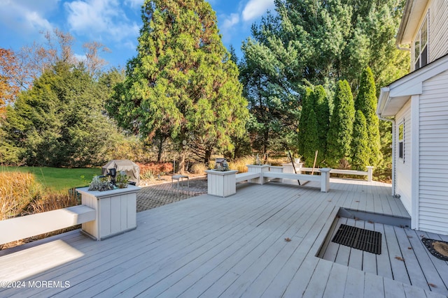 wooden terrace featuring area for grilling