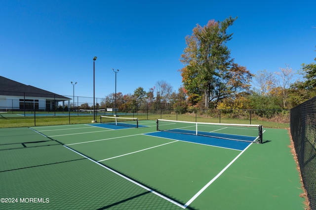 view of sport court featuring community basketball court and fence