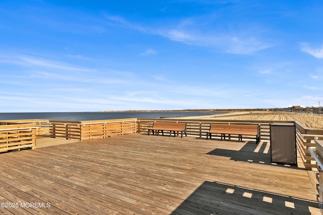 wooden terrace with a water view