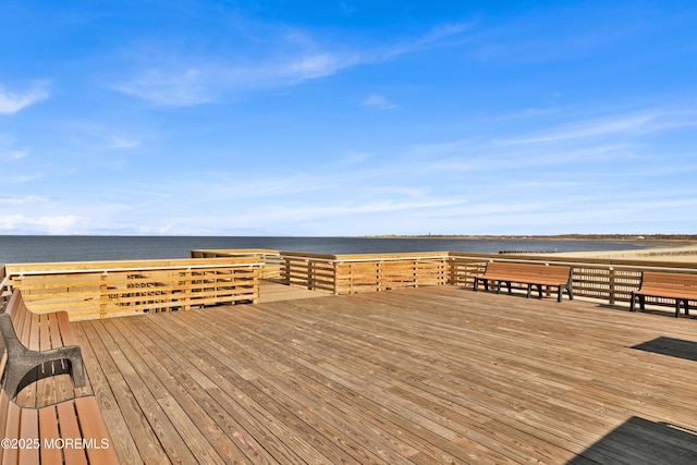 wooden deck featuring a water view