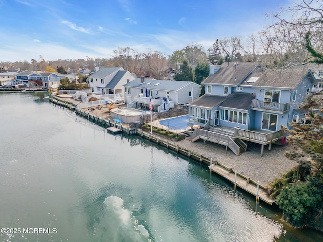 aerial view with a residential view and a water view