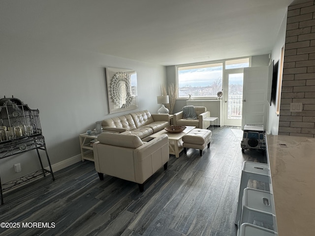 living area featuring dark wood-style flooring and baseboards